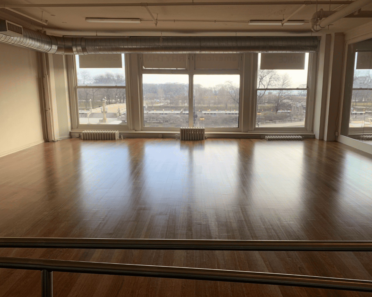 Image Description: Annex rehearsal studio A, with windows overlooking Grant Park and mirrors.