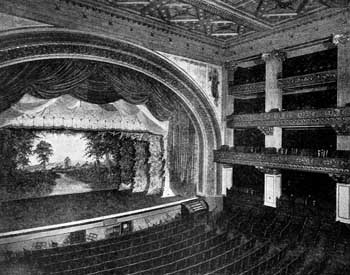 Image Description: Historic photograph of the Studebaker Theater's arched proscenium and balconies.